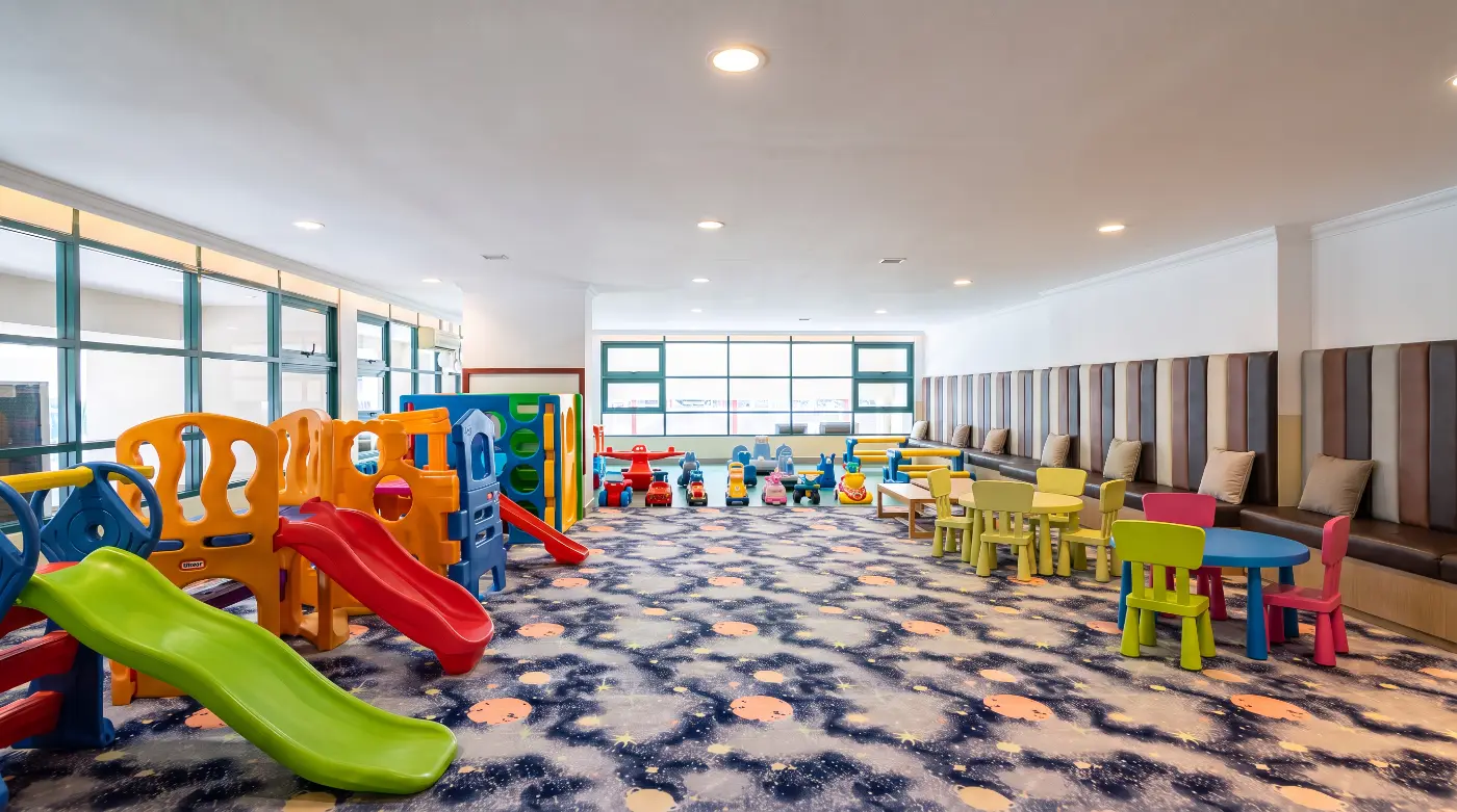 Children's playroom with slides and small tables