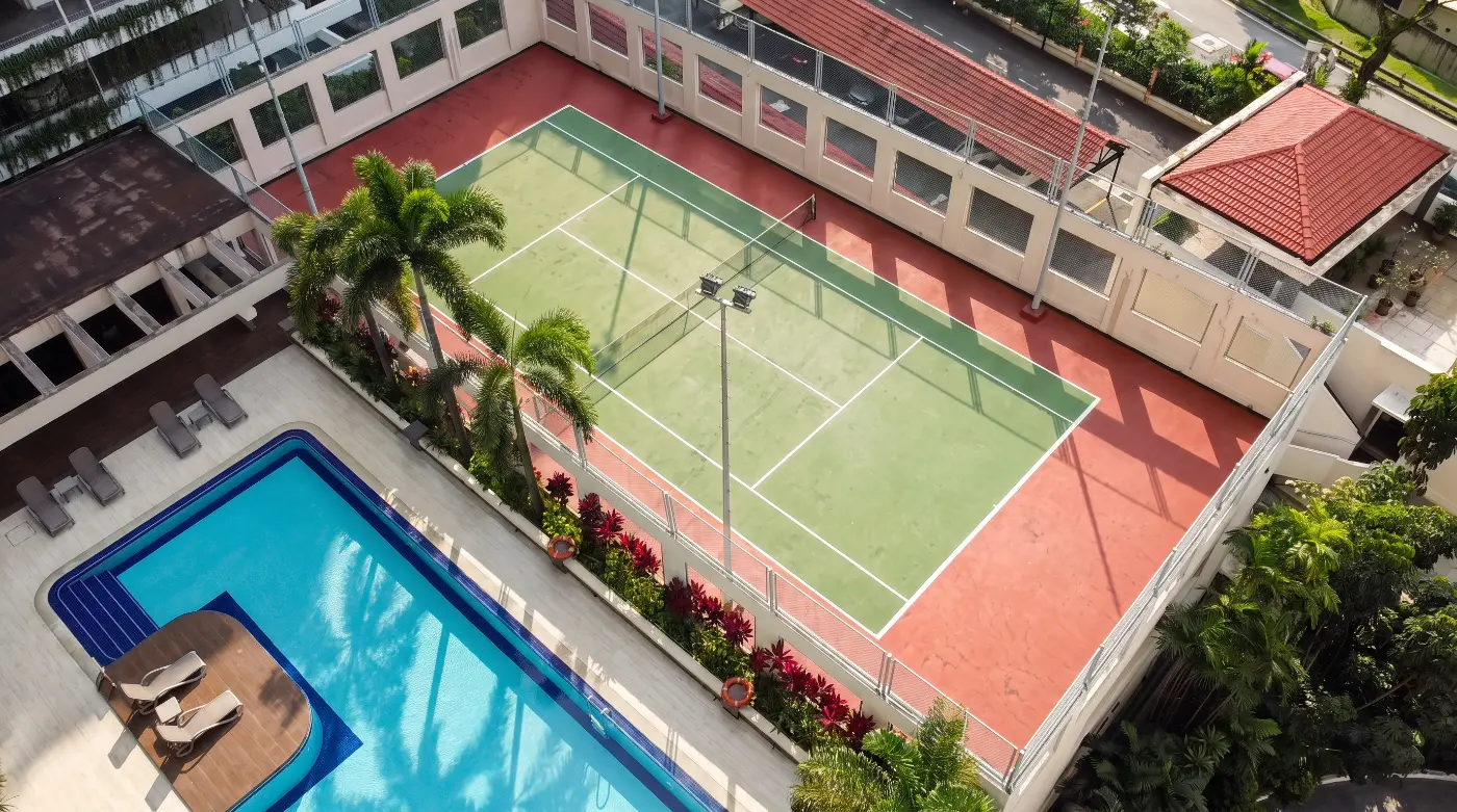 Aerial view of the tennis court beside the pool